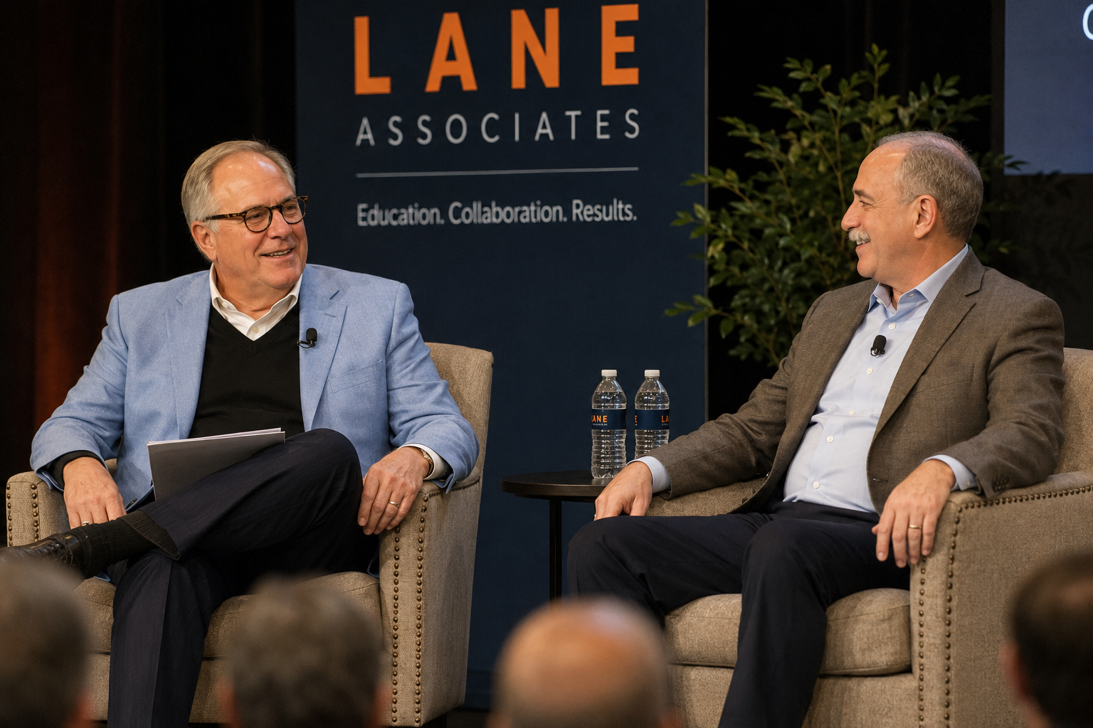 Chris Nicely in conversation on stage at a LANE Associates event